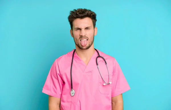 Handsome Teenager Feeling Disgusted Irritated Tongue Out Nurse Concept — Stock Photo, Image