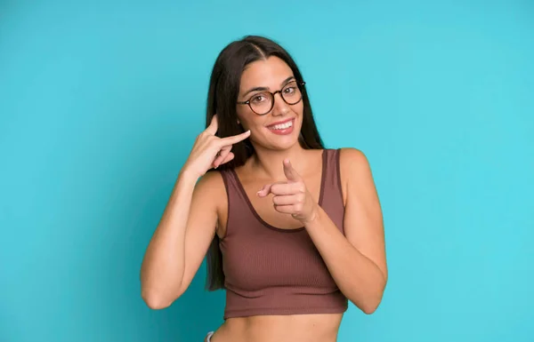Hispanic Pretty Woman Smiling Cheerfully Pointing Camera While Making Call — Stock Photo, Image