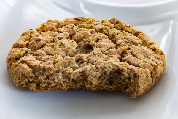 Close up of bitten oatmeal cookie