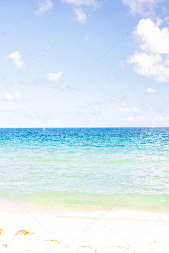Overexposed seashore beach with sand and sky in light colors to be used as a full page background