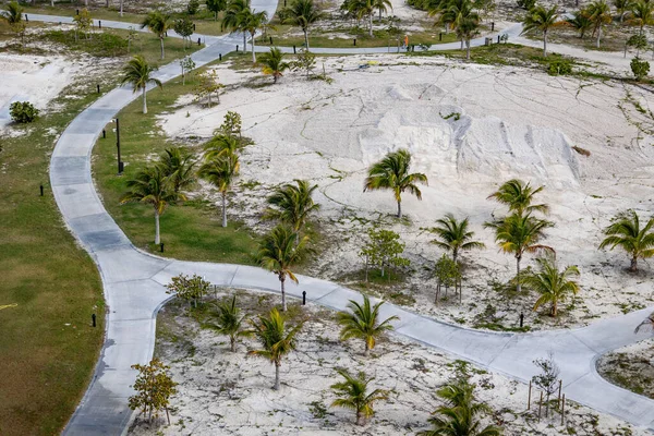 Asphalted Trail Pile Sand Some Vegetation Palm Trees Tropical Island — Fotografia de Stock