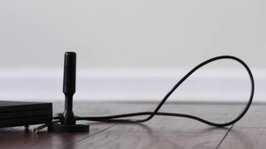 Parallax effect behind cryptocurrency mining device with aerial antenna