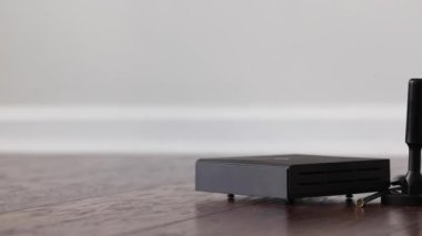 Wireless hotspot for Helium cryptocurrency token mining with stock over the air antenna placed on top of it