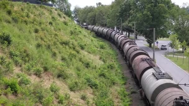 Train Cars Carrying Chemicals Liquids Slowly Pass Next Pedestrian Walkway — ストック動画