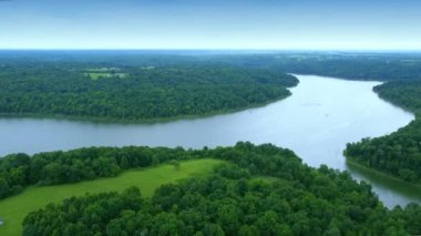 Flying over hills, lawns and forest surrounding Taylorsville lake in Central Kentucky
