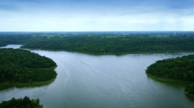 Descending over Taylorsville lake in Central Kentucky. Recreational boats sailing in the wide area of the lake.