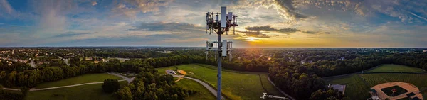 Aerial view of cell phone repeater tower in a middle of panoramic landscape