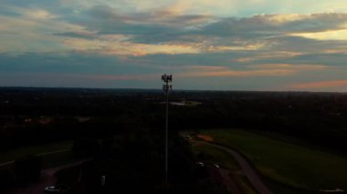 Silhouette of wireless repeater tower on a hill of a mid west city of Lexington, Kentucky USA
