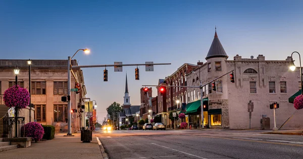Scarce traffic on Main Street in downtown Woodford county\'s Versailles, KY during sunrise