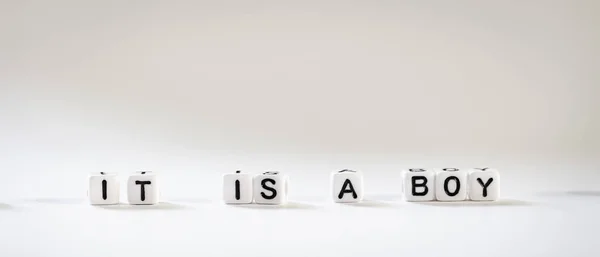 Announcement Boy Assembled Letters Made Out Tiny White Plastic Cubes — Stock Photo, Image