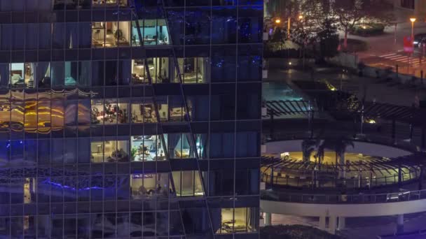Windows lights in modern office and residential buildings timelapse at night — Stock Video