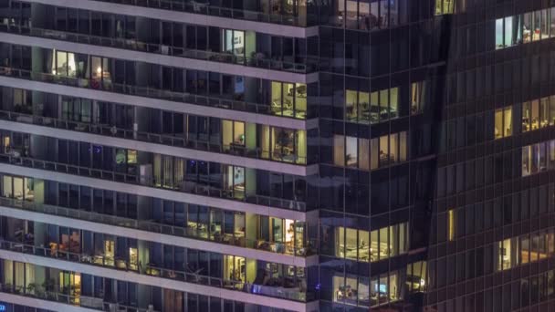 Windows lights in modern office and residential buildings timelapse at night — Stock Video