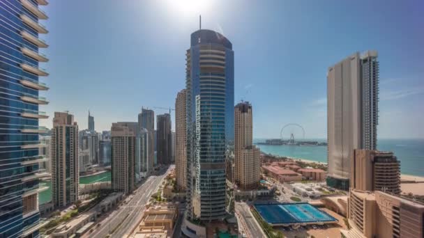 Panoramic sunset view of the Dubai Marina and JBR area and the famous Ferris Wheel aerial timelapse — Stock Video