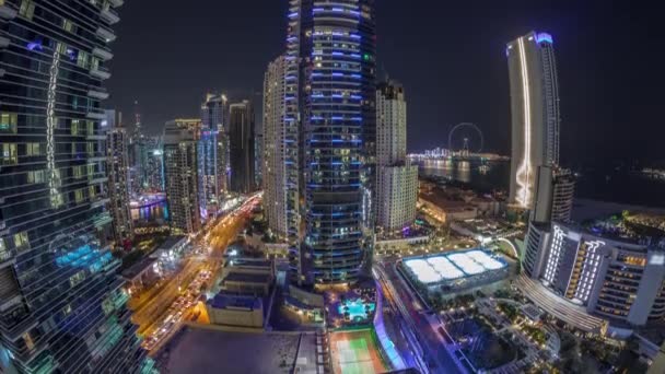 Panorámás kilátás a Dubai Marina és a JBR terület és a híres Ferris Wheel légi éjszakai időtöltés — Stock videók