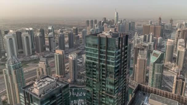 Dubai Marina and JLT district with traffic on highway between skyscrapers aerial timelapse. — Stock Video