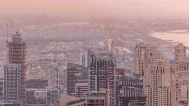 Skyline panoramic view of Dubai Marina showing an artificial canal surrounded by skyscrapers along shoreline timelapse. DUBAI, UAE — Stock Video