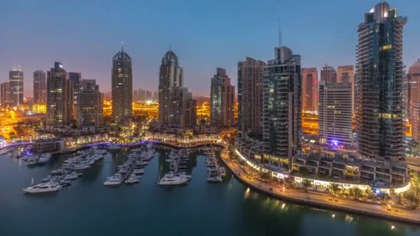 Luxury yacht bay in the city aerial night to day timelapse in Dubai marina — стоковое видео
