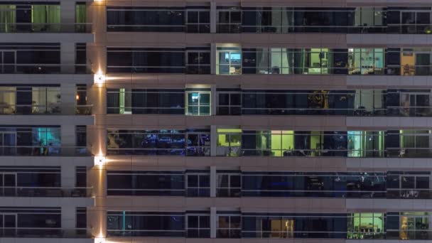 Flat night panorama of multicolor light in windows of multistory buildings aerial timelapse. — Video Stock