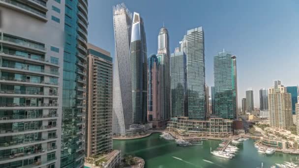 Panorama showing Dubai marina tallest skyscrapers and yachts in harbor aerial timelapse. — Vídeo de Stock