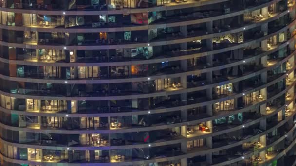 Outside view of windows in apartments of a high class building at night timelapse — 图库视频影像