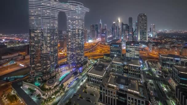 Futuristic Dubai Downtown and finansial district skyline aerial night timelapse. — Stockvideo