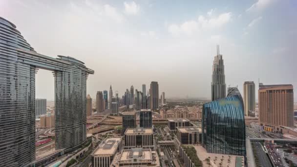 Футуристический Дубай Dubai Downtown and Fessial District skyline air day to night timelapse. — стоковое видео
