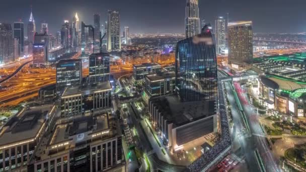 Futuristic Dubai Downtown and finansial district skyline aerial night timelapse. — Stock Video