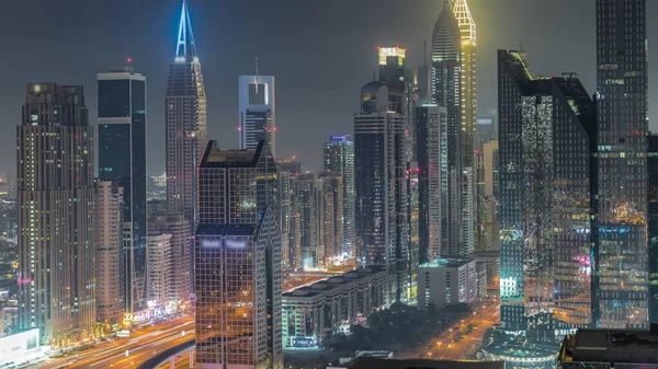 Dubai Financial Center District Tall Skyscrapers Illuminated Night Timelapse Aerial — Fotografia de Stock