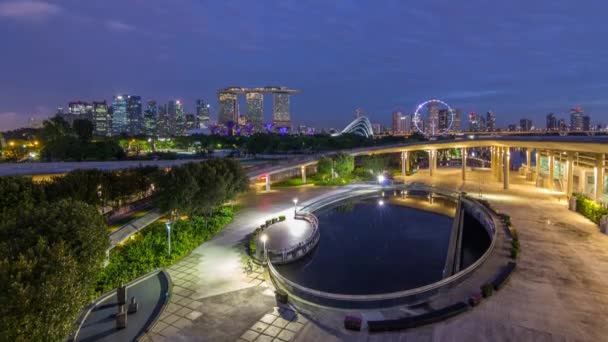 Panorama of Singapore with Gardens by the bay night to day timelapse before sunrise — Wideo stockowe