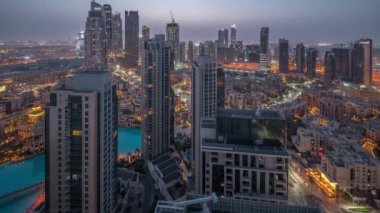 Aerial panoramic view of a big futuristic city night to day timelapse. Business bay and Downtown