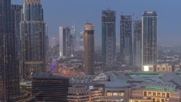 Dubai downtown near fountains and modern futuristic architecture aerial day to night timelapse — Stock Video
