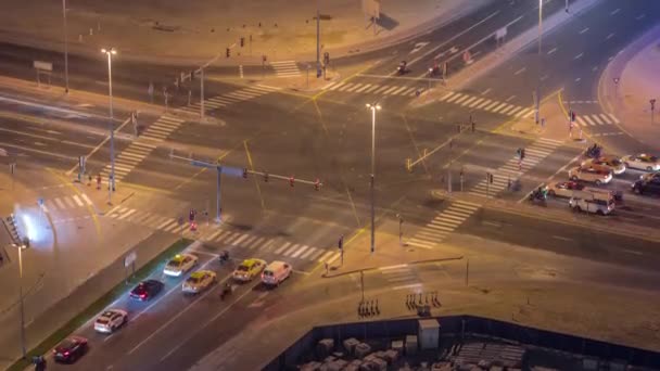 Bussy traffic on the road intersection in Dubai downtown aerial night timelapse, UAE — Stock Video