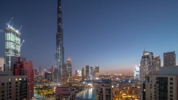 Dubai Downtown cityscape with tallest skyscrapers around aerial night to day timelapse. — Stock Video