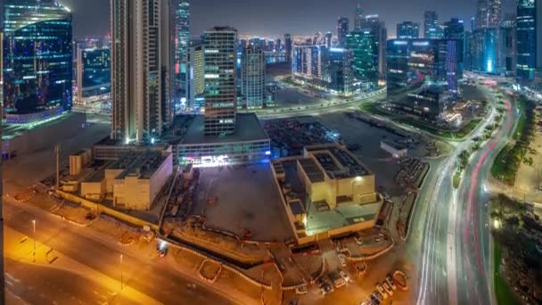 Business Bay Dubaj mrakodrapy s vodní kanál letecké noci timelapse. — Stock video
