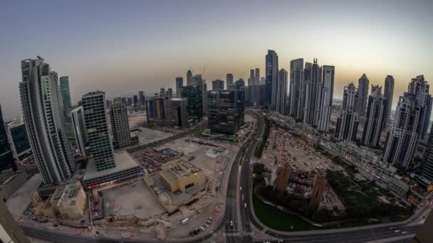 Skyline panorâmico da Bay Avenue com torres modernas desenvolvimento residencial em Business Bay dia a noite timelapse, Dubai — Vídeo de Stock