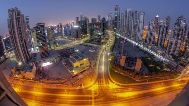 Bay Avenue com torres modernas desenvolvimento residencial em Business Bay panorâmica noite-a-dia timelapse, Dubai — Vídeo de Stock