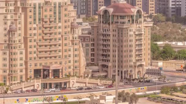 Aerial view to financial district in Dubai with hotels and traffic on the road timelapse. — Stock Video