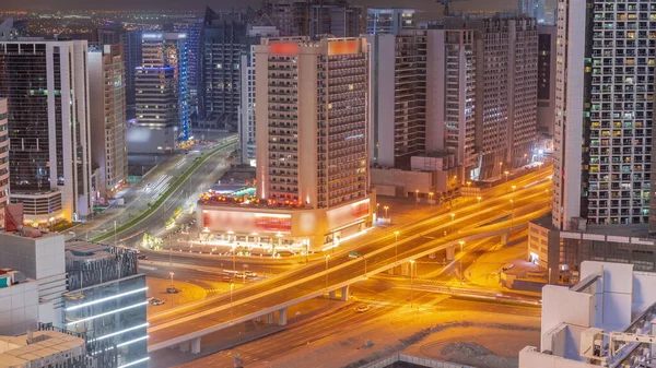 Rascacielos Bahía Negocios Dubai Timelapse Noche Aérea Cruce Carreteras Construcción —  Fotos de Stock