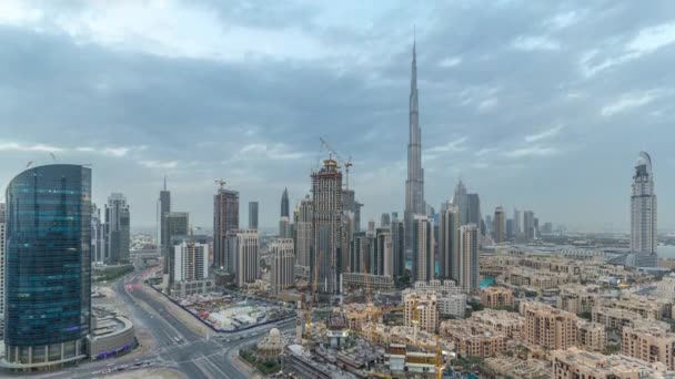 Dubai Downtown day to night timelapse. Aerial view over big futuristic city by night. — Stock Video