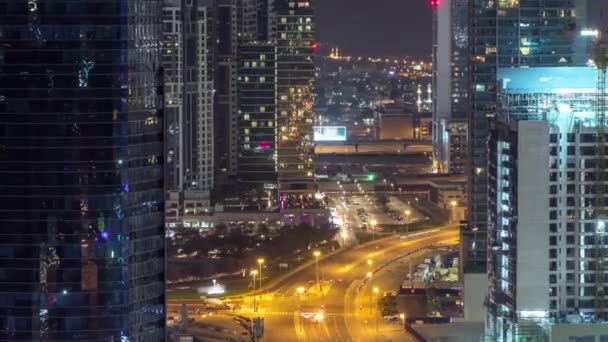 Dubai bay towers night timelapse aerial — стоковое видео