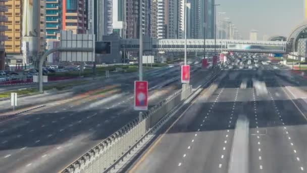 Busy Sheikh Zayed Road timelapse, metro railway and modern skyscrapers around in luxury Dubai city — Stock Video