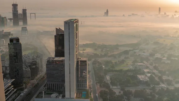 Flygfoto Över Skyskrapor Nära Finanscentrum Täcks Morgondimma Dubai Timelapse Byggarbetsplats — Stockfoto