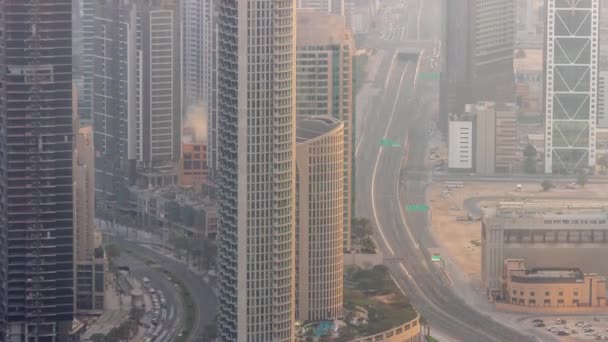 Bussy traffic on a road intersection in Dubai downtown aerial timelapse. — Stock Video