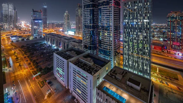 Вид Воздуха Дубайский Международный Финансовый Район Многими Освещенными Небоскребами Ночью — стоковое фото