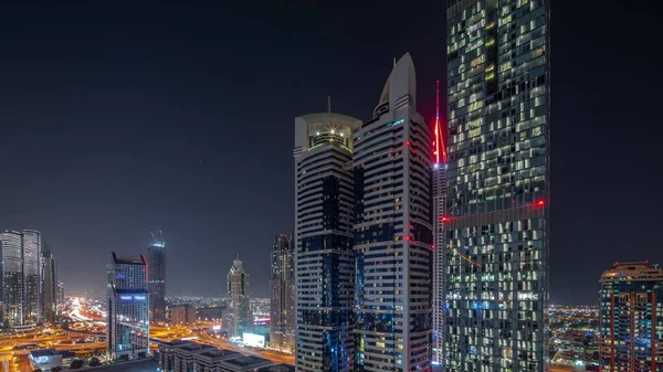 Αεροφωτογραφία Της Διεθνούς Οικονομικής Περιοχής Ντουμπάι Πολλούς Ουρανοξύστες Νύχτα Timelapse — Φωτογραφία Αρχείου