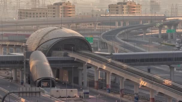 Futuristic building of Dubai metro station and luxury skyscrapers back in Dubai Marina air timelapse, United Arab Emirates — стокове відео