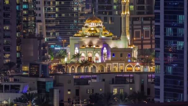 Dubai Marina skyline with Mohammad Bin Ahmed Al Mulla mosque aerial timelapse at night. — Stock Video