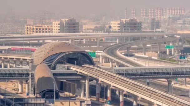 Futuristic building of Dubai metro station and luxury skyscrapers behind in Dubai Marina aerial timelapse, United Arab Emirates — Stock Video
