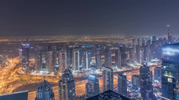 Panorama de Dubai Marina com arranha-céus JLT e campo de golfe noite a dia timelapse, Dubai, Emirados Árabes Unidos. — Vídeo de Stock