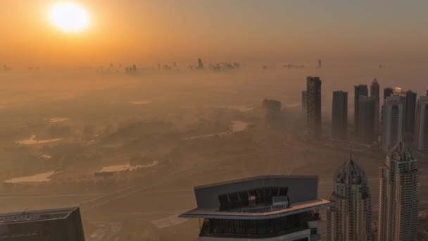 Panorama of Dubai Marina with JLT skyscrapers and golf course during sunrise timelapse, Dubai, United Arab Emirates. — Stock Video